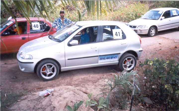 Picture of Fiat Palio 1.6, no. 41, with Twin Surbos. This one was taken at the start line of the 2nd lap. The one in the blue inside is my friend, Ashok, who drove the car in the rally. The guy standing and leaning on my car is my best friend.
 
